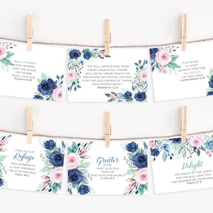 May include: Set of six printable cards with floral designs and inspirational bible verses. The cards feature blue and pink flowers with green leaves. The verses include "In all things God works for the good of those who love Him", "He will wipe every tear from their eyes. There will be no more death or mourning or crying or pain, for the old order of things has passed away.", "It is good to wait quietly for the salvation of the Lord", "God is our refuge and strength, a very present help in trouble", "Greater is he that is in you than he that is in the world", and "Delight yourself in the Lord and he will give you the desires of your heart".
