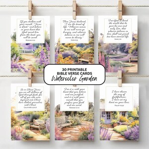 May include: Six rectangular cards featuring watercolor garden scenes with wooden benches and printed Bible verses. The text includes Romans 10:9, John 6:35, John 3:16, Galatians 3:26-27, Romans 10:10, and Psalm 119:30. A central label reads 30 PRINTABLE BIBLE VERSE CARDS Watercolor Garden.