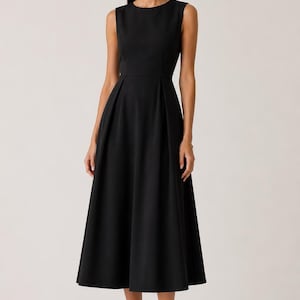 May include: A solid black sleeveless midi dress featuring a round neckline, a fitted bodice, and a pleated skirt that flares out from the waist. The dress has a clean, structured silhouette and falls to a mid-calf length, providing a simple and uniform appearance.