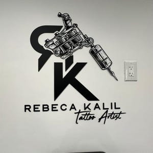 May include: Black and white logo for a tattoo artist named Rebecca Kalil. The logo features a stylized tattoo machine and the letters "RK" in a bold font.