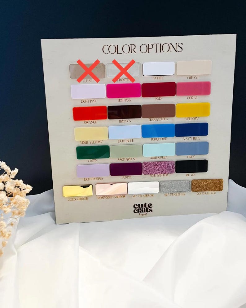 May include: A rectangular display board titled COLOR OPTIONS featuring a grid of small, labeled rectangular swatches in various colors and finishes, including matte, glitter, and mirror textures, with the logo cute crafts design at the bottom.