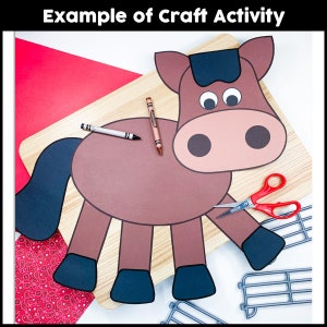 May include: A brown paper horse craft with black mane, tail, and hooves. The horse is on a wooden surface with a red background and a pair of scissors.