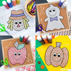 May include: Four different dot-to-dot activity sheets for kids. The sheets feature a scarecrow, a ghost, an apple, and a pumpkin. Each sheet has a black and white outline of the image with circles inside. The circles are to be colored in with paint or markers. The sheets are on cork boards with paint, cotton swabs, and scissors around them.