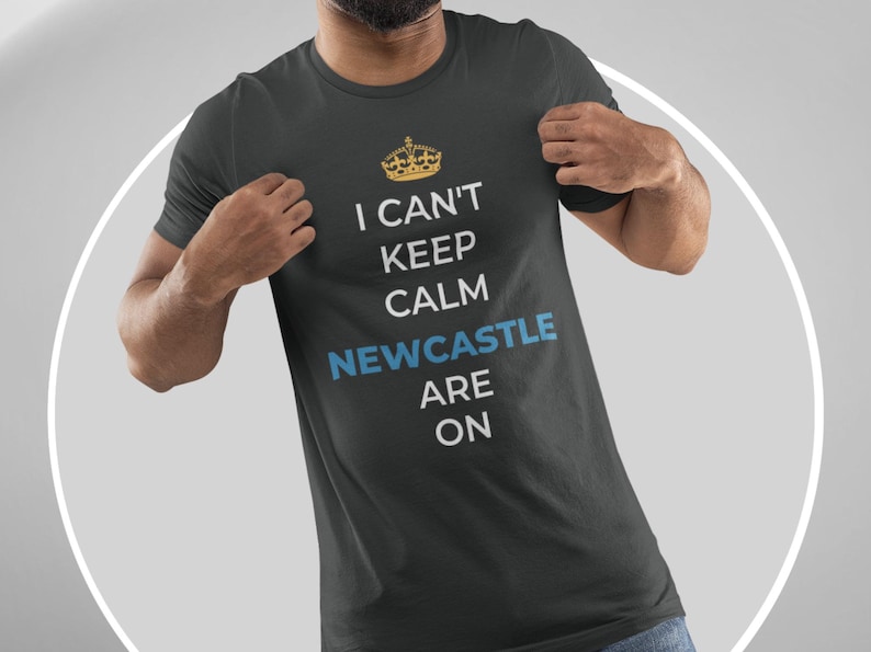 May include: A black t-shirt with a white graphic that says "I can't keep calm Newcastle are on" with a gold crown above the text.