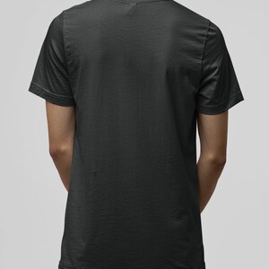 May include: A plain black t-shirt with short sleeves. The t-shirt is made of a soft, comfortable fabric.