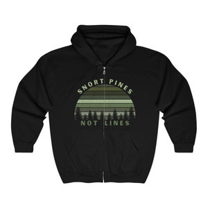 May include: Black zip-up hoodie with a forest-themed graphic. The design features a green and brown striped sun with pine trees and the text "SNORT PINES NOT LINES" in a green font. The hoodie has a hood and a full-length zipper.