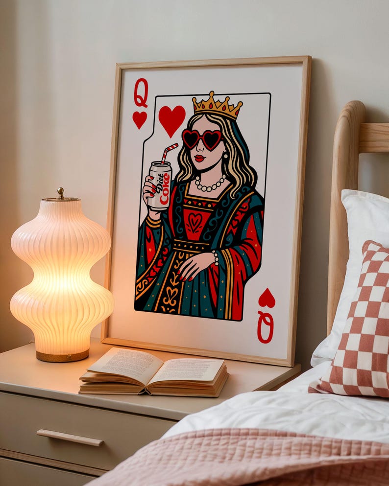 May include: A framed wall art print depicting a Queen of Hearts playing card. The queen wears a gold crown, heart-shaped sunglasses, and a pearl necklace, while holding a silver can labeled Diet Coke with a red and white striped straw.