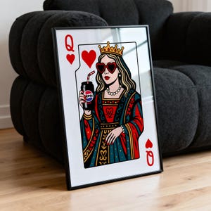 May include: Framed art print featuring a Queen of Hearts playing card design. The queen wears heart-shaped sunglasses and a crown, holding a Pepsi can. The artwork is in a black frame, with red, blue, and gold accents.