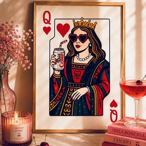 May include: A framed wall art print depicting a Queen of Hearts playing card character wearing heart-shaped sunglasses and a crown, holding a silver Diet Coke can with a red and white striped straw, rendered in a bold, colorful graphic illustration style.