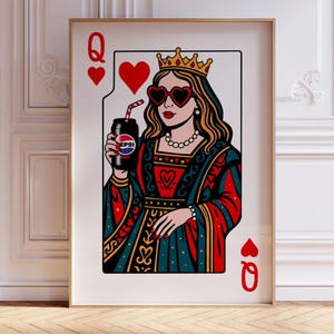 May include: Framed art print of a Queen of Hearts playing card. The queen wears a crown and heart-shaped sunglasses, holding a Pepsi can with a straw. The card design features red, black, and gold colors.