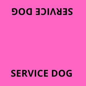 May include: A bright pink rectangular sign featuring the black text SERVICE DOG printed at the top and bottom, and DO NOT INTERACT printed along both side edges. A small logo with a dog icon and the text WAGAROUND TOWN is in the corner.