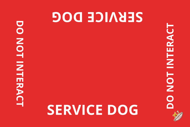 May include: A rectangular red sign featuring the white text SERVICE DOG printed at the top and bottom, with the text DO NOT INTERACT printed vertically along both the left and right sides. A small logo is visible in the bottom right corner.