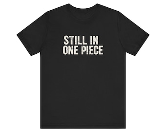 Still In One Piece T-Shirt | Vintage Distressed Text Tee