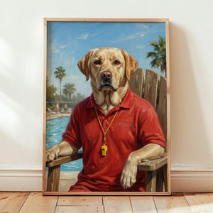 May include: A framed print featuring a yellow Labrador Retriever wearing a red lifeguard shirt and a whistle. The dog is seated in a wooden chair, with a swimming pool and palm trees in the background. The shirt reads "Lifeguard".