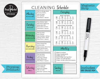 May include: A printable cleaning schedule checklist with a dry erase marker. The checklist is divided into daily, weekly, and monthly tasks. The days of the week are color-coded and include tasks for bedrooms, kitchen, living room, bathrooms, office/den, and miscellaneous tasks. The checklist also includes a section for everyday tasks such as making the bed, doing laundry, and wiping down counters.
