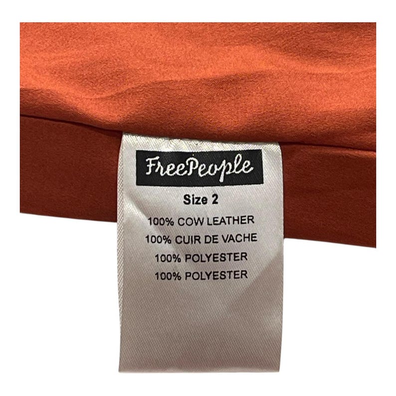 Vestido con pechera de gamuza Free People, talla 2, color naranja óxido, con dobladillo sin rematar y forro. imagen 9