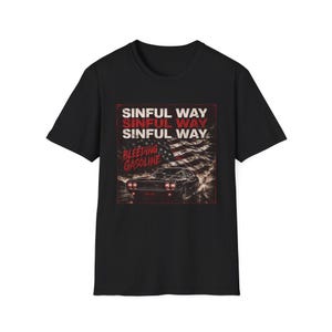 May include: A black short-sleeve t-shirt featuring a graphic print of a vintage muscle car, a distressed American flag, and the text SINFUL WAY and BLEEDING GASOLINE in red and white lettering. The design is centered on the front of the shirt.