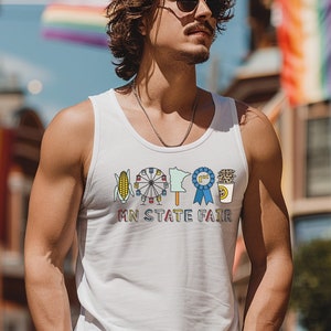 May include: White tank top with a colorful graphic of fair icons and the text "MN STATE FAIR". The design includes a corn on the cob, Ferris wheel, state outline, blue ribbon, and a coffee cup. The tank top is sleeveless.
