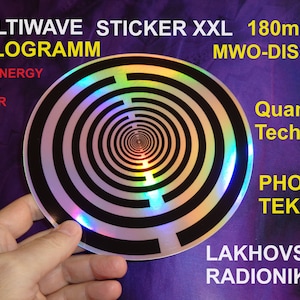 May include: A silver holographic sticker with a black and white concentric circle pattern. The sticker is 180mm in diameter and has the text "MULTIWAVE STICKER XXL 180mm HOLOGRAMM MWO-DISC LIFE-ENERGY AURA-POWER Quanten Technik PHOTON TEK LAKHOVSKY RADIONIK" printed around the edge.