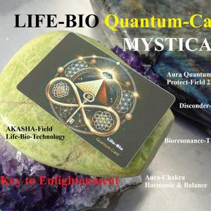 May include: A black Life-Bio Quantum-Card Mystica with a key and eye design, resting on a green stone and purple crystal. Text includes "AKASHA-Field Life-Bio-Technology" and "Key to Enlightenment". Additional text mentions "Aura Quantum Protect-Field 2M".