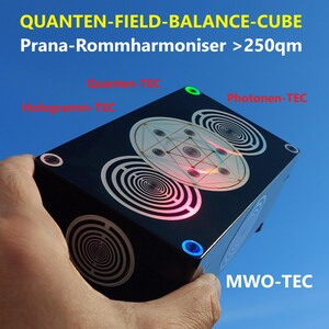 May include: A black cube with a circular design and glowing lights. The cube is labelled "QUANTEN-FIELD-BALANCE-CUBE Prana-Rommharmoniser >250qm", "Photonen-TEC", "MWO-TEC", and "Radionik".
