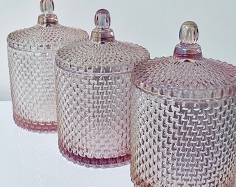 Luxury pink pearlescent geo glass storage jar with ornate lid.