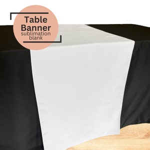 May include: White table runner on a black tablecloth. The table runner is a sublimation blank, meaning it can be printed on with a heat press.  Table Banner sublimation blank.
