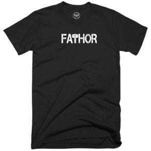 May include: Black t-shirt with white text that reads "FATHOR" with a hammer graphic above the "H".