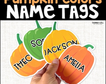 May include: A hand holds four pumpkin-shaped name tags in orange, green, and yellow. Each tag has a different name: Theo, Jackson, Amelia, and So. The text "Pumpkin Colors NAME TAGS" is at the top, and "EDITABLE IN POWERPOINT" is at the bottom.