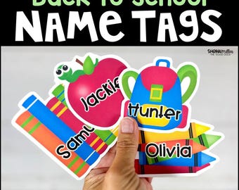 May include: Back to School name tags featuring colorful illustrations of a red apple with a green worm, a blue backpack, and multi-colored crayons. Each tag displays a name in black text, including Jackie, Hunter, Samuel, and Olivia.