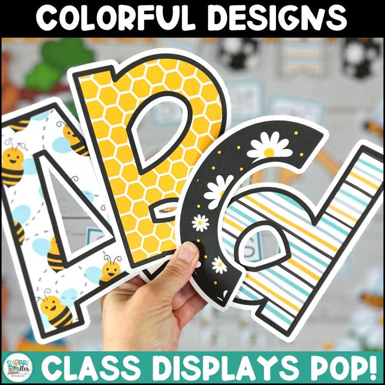 May include: Colorful alphabet letters with different patterns, including a honeycomb design, a black and white daisy pattern, and a blue and yellow striped pattern. The letters are cut out and ready to be used for classroom displays. The text "CLASS DISPLAYS POP!" is at the bottom of the image.