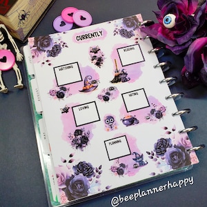 May include: A planner page with a Halloween theme. The page is decorated with black roses, bats, spiders, and witches. The page has several boxes with the words "Currently", "Reading", "Hatching", "Loving", "Hating", and "Planning".