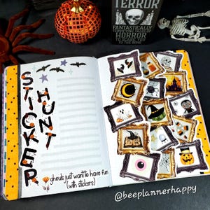 May include: Open notebook with Halloween-themed stickers in ornate frames. The word "STICKER HUNT" is written vertically on the left page. A decorative pumpkin and a book titled "TERROR" are in the background. The text "ghouls just want to have fun (with stickers)" is also visible.