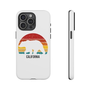 May include: White phone case with a retro design. It features a bear silhouette against a sunset of red, orange, yellow, and teal stripes. The word "CALIFORNIA" is printed in black below the bear.