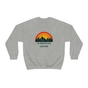 The Mountain Fixes Everything Unisex Heavy Blend Crewneck Sweatshirt for the Outdoors Camping Vacation Relaxing