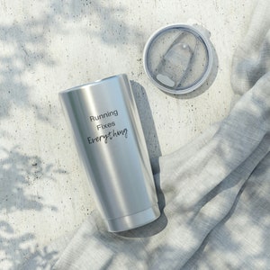 May include: A stainless steel tumbler with a silver lid and the text "Running Fixes Everything" engraved on the side.