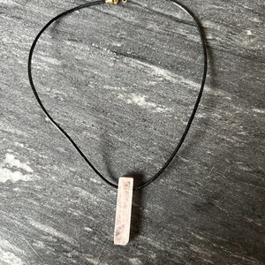 Rose quartz ( genuine) in a 16” leather cord with closure