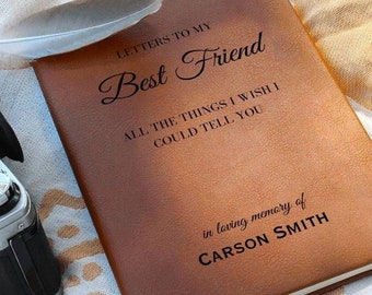 May include: A brown leather journal with the text "Letters to my Best Friend" and "All the things I wish I could tell you" in black lettering. The journal also has the text "in loving memory of CARSON SMITH" in black lettering.
