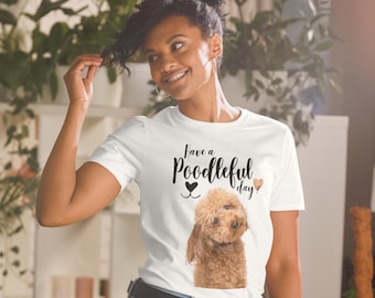May include: White t-shirt with a brown poodle and the text "Have a Poodleful day!" in black lettering.
