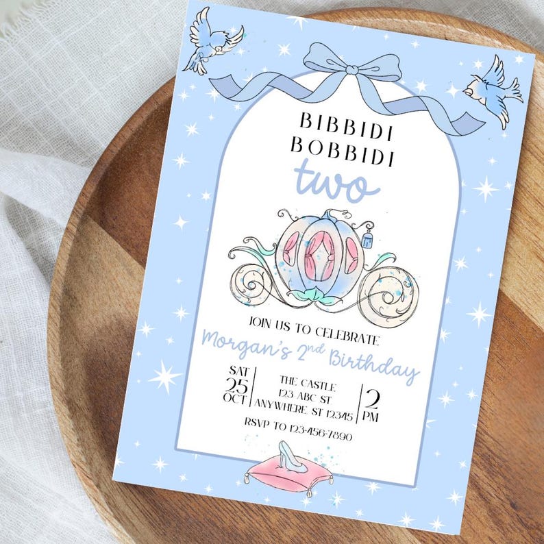 May include: A light blue birthday invitation with a fairytale theme. The invitation features a carriage, birds, and the words "Bibbidi Bobbidi Two." The invitation includes the date, time, and location of the party.