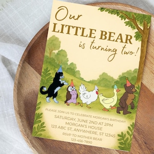 May include: A birthday invitation with the text "Our LITTLE BEAR is turning two!" features a line of cartoon animals wearing party hats. The invitation includes event details: date, time, location, and RSVP information.