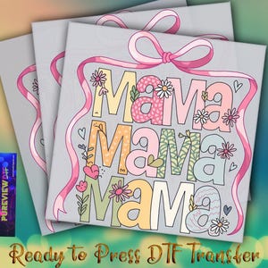 May include: Three gray canvases with the word "Mama" in colorful, floral-decorated letters. A pink ribbon with a bow and hearts adorns the design. The text "Ready to Press DTF Transfer" is at the bottom.