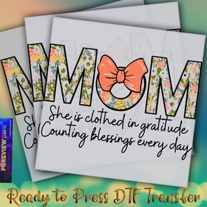May include: Three white canvases with the word "MOM" in a floral pattern and a peach bow. The text "She is clothed in gratitude, Counting blessings every day" is below. The phrase "Ready to Press DTF Transfer" is at the bottom.