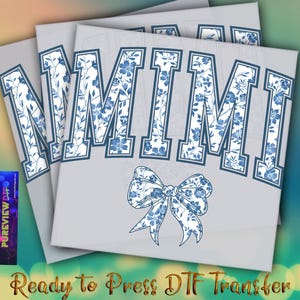 May include: DTF transfer sheets with the word "MIMI" in blue floral print letters. A matching bow graphic is below the word. The text "Ready to Press DTF Transfer" is at the bottom. The sheets are on a gradient background.
