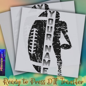 May include: A stack of white canvas prints featuring a distressed black football design with the text "YOUR NAME" vertically. A silhouette of a football player holding a ball is also included. The words "Ready to Press DTF Transfer" are at the bottom.