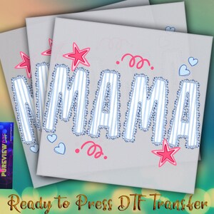 May include: Three gray DTF transfer sheets with the word "MAMA" in a blue and white striped design. Pink stars, hearts, and swirls decorate the design. The text "Ready to Press DTF Transfer" is at the bottom.