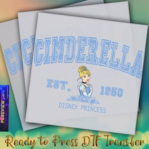 May include: A light blue iron-on transfer featuring a cartoon image of Cinderella with the text "CINDERELLA EST. 1950 DISNEY PRINCESS".