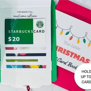May include: A gift card holder with a green and white design, featuring a Starbucks gift card valued at $20. The holder is open, revealing slots for multiple cards. The text "FOR WHEN YOU... need some caffeine" is visible.