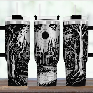 May include: Black and white travel mugs with a castle and forest design. The stainless steel tumblers have a black handle, lid, and straw. The castle design features a large sun, bridges, and trees.