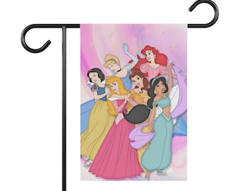 May include: A garden flag featuring a group of Disney princesses, including Cinderella, Snow White, Aurora, Ariel, Jasmine, and Belle. The princesses are depicted in their iconic dresses and are standing together on a pink and purple background with stars.